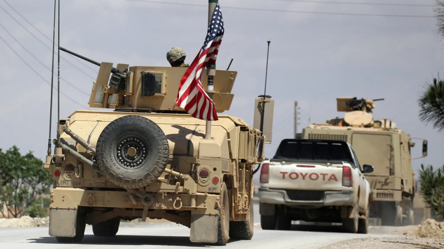 File photo: The US flag flutters on a military vehicle in Manbij countryside, Syria, on May 12, 2018. Aboud Hamam / Reuters