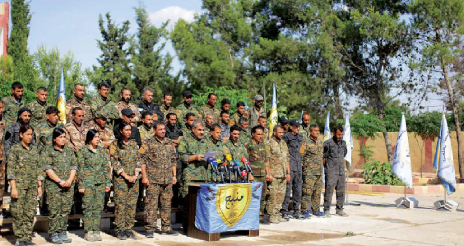 مجلس منبج العسكري خلال مؤتمر صحافي أمس (رويترز)