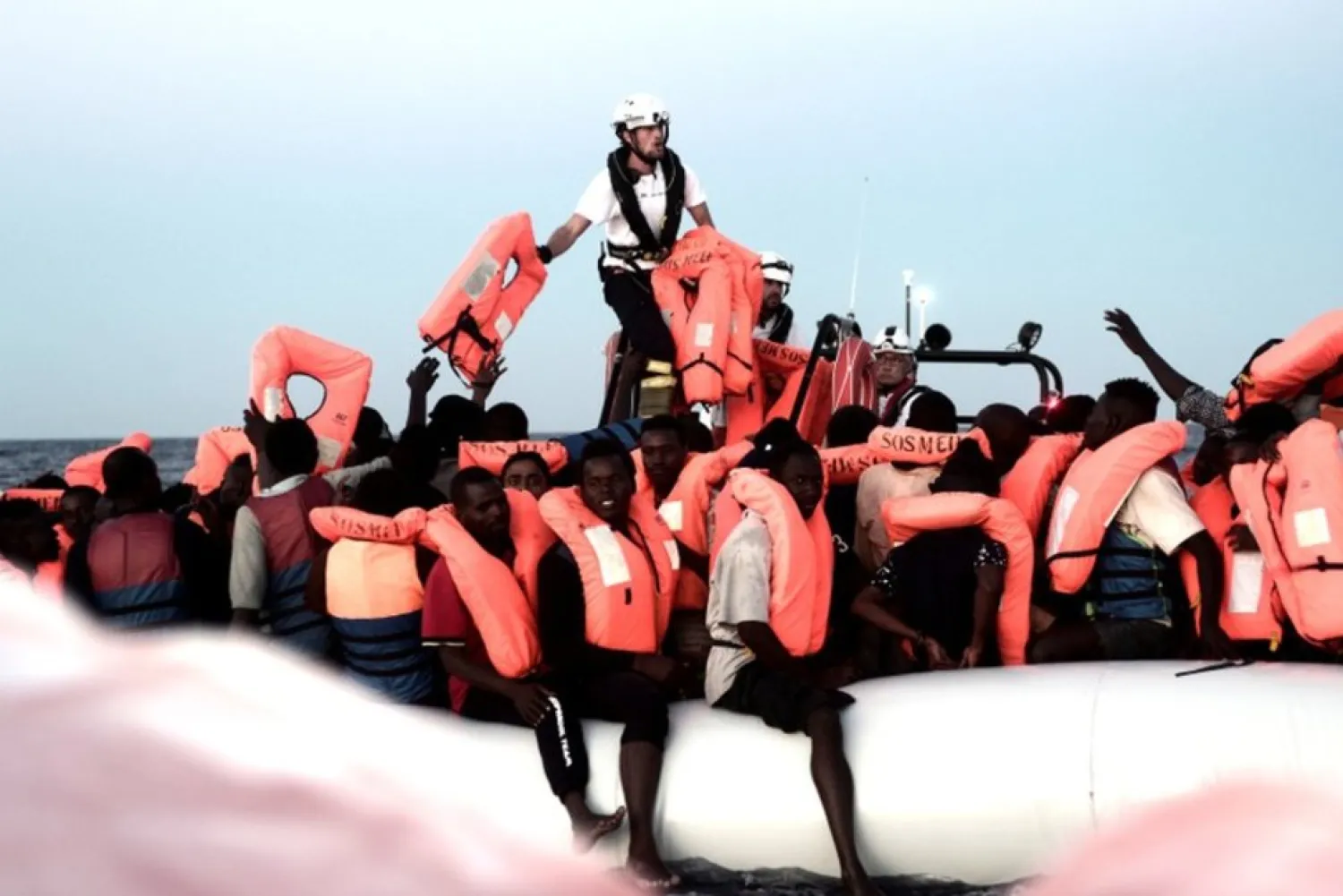 Migrants are rescued by staff members of the MV Aquarius, a search and rescue ship run in partnership between SOS Mediterranee and Medecins Sans Frontieres in the central Mediterranean Sea, June 9, 2018. Karpov/handout via REUTERS