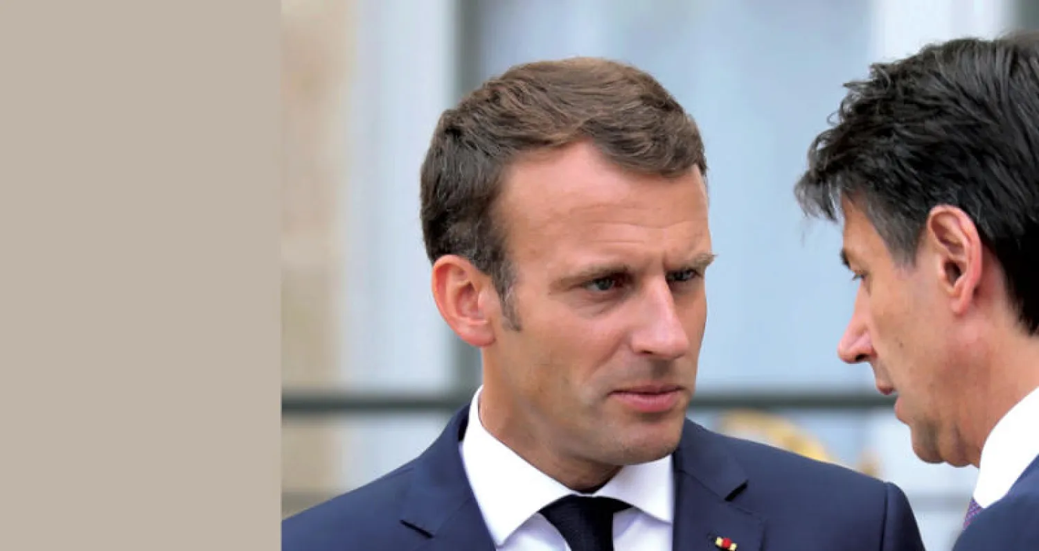 ما قاله ماكرون لقي صدى إيجابياً لدى كونتي الذي دعا إلى تغيير جذري للقواعد المعمول بها (أ.ف.ب)