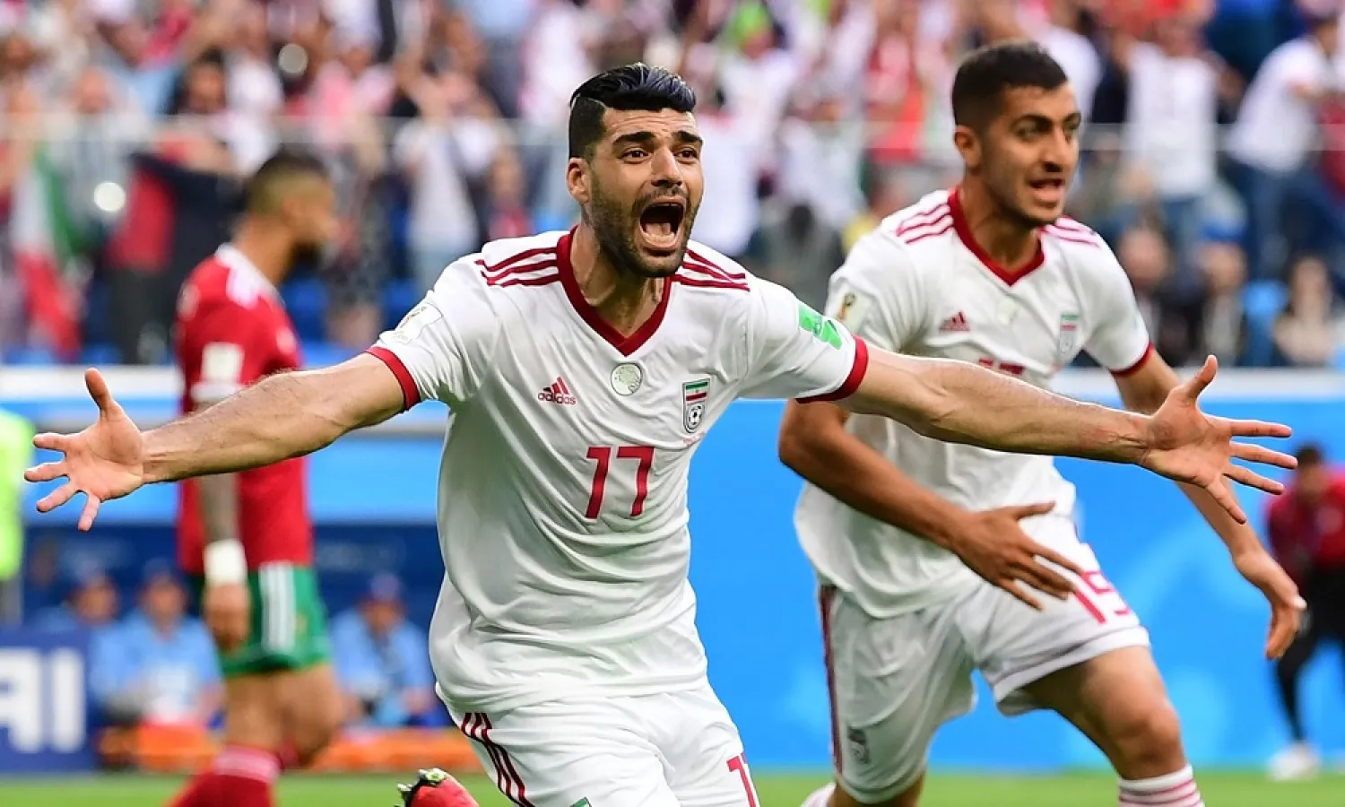 Iran’s Mehdi Taremi reacts after Morocco scored a late own goal. (AFP)