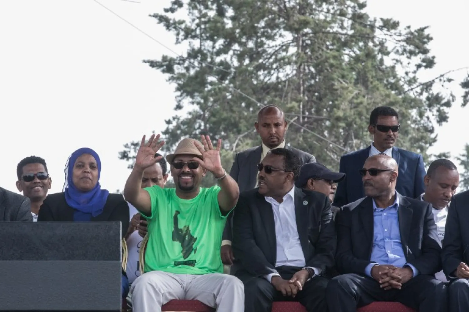 Ethiopia Prime Minister Abiy Ahmed (3rd L) waves to his supporters during a rally on Meskel Square in Addis Ababa on June 23, 2018. YONAS TADESE / AFP