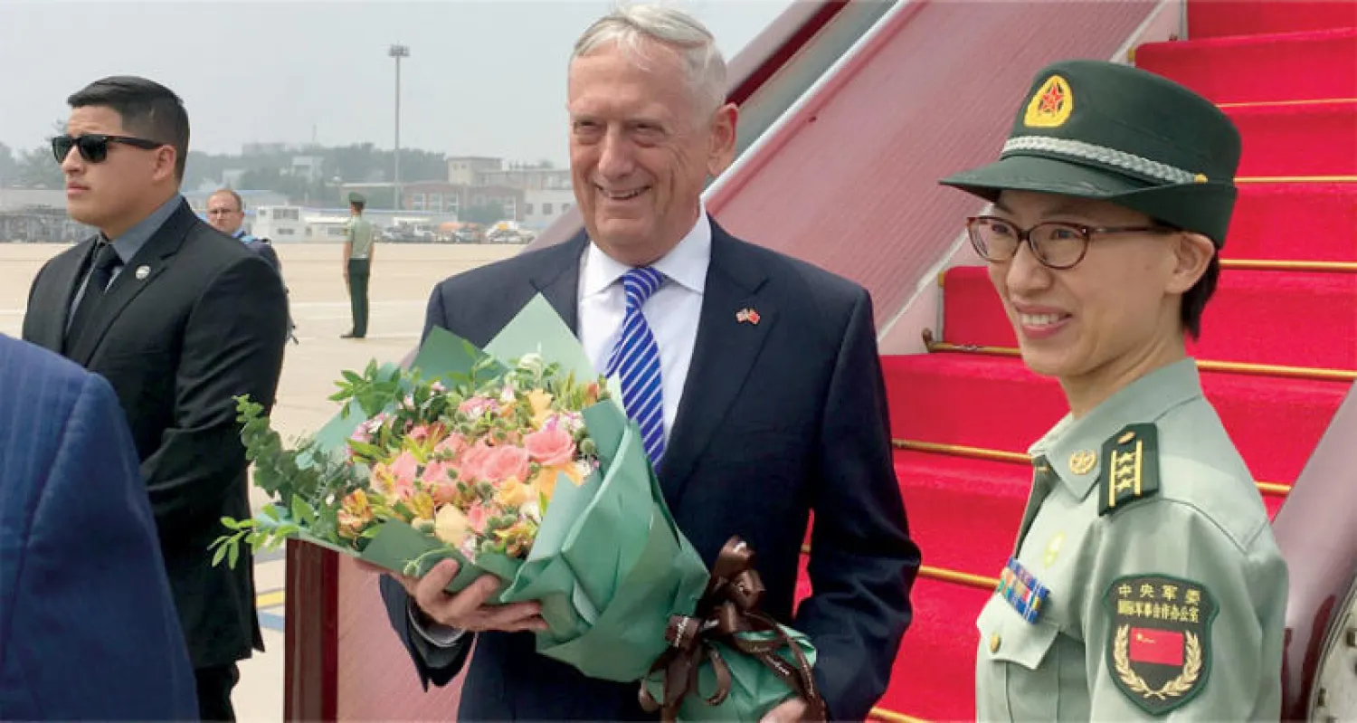 ماتيس لدى وصوله إلى بكين أمس (رويترز)