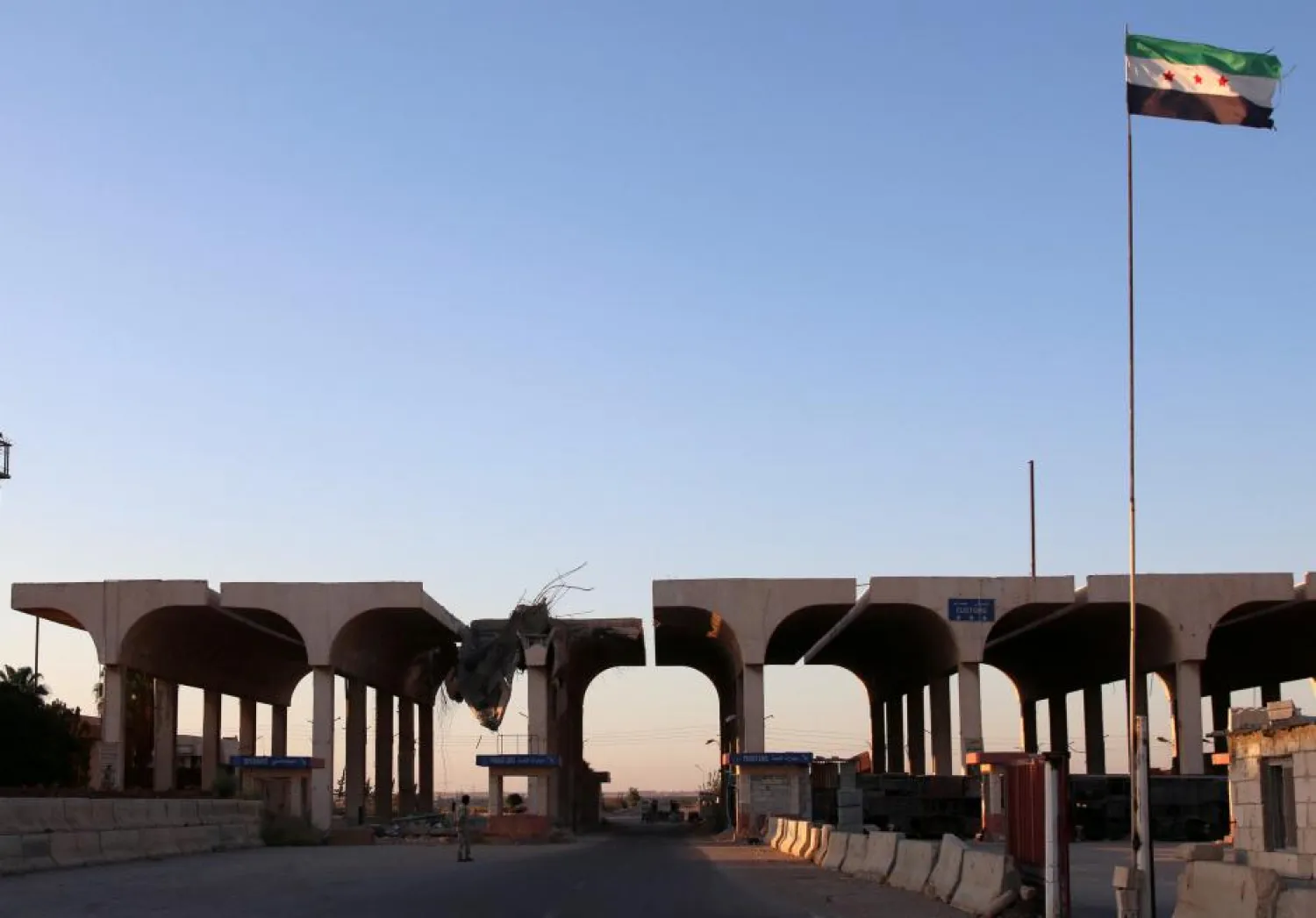 A Syrian opposition flag is erected at the Syrian-Jordanian border at the Nassib crossing in Daraa province in August 2017. (Reuters)
