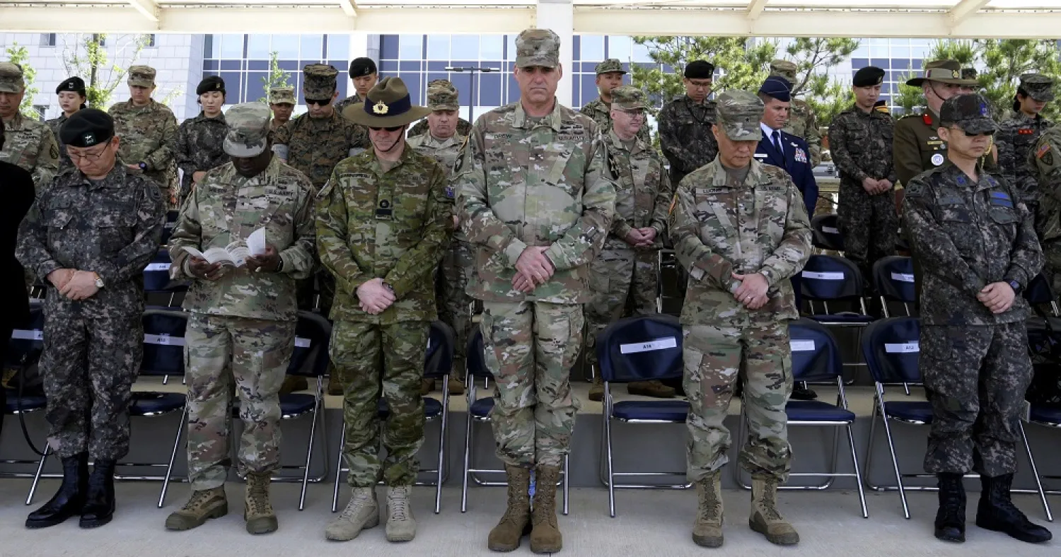 US and South Korean soldiers pray during a ceremony marking the US Memorial Day at Camp Humphreys in Pyeongtaek, South Korea in May. (AP)