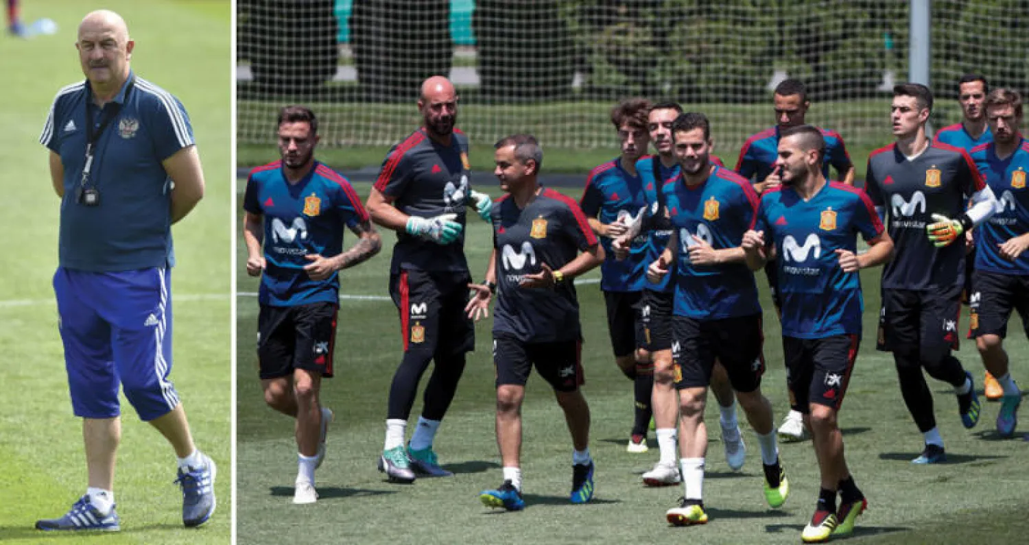 المنتخب الإسباني متحفز لإنهاء عقدة أصحاب الأرض ومواصلة التقدم (إ.ب.أ)  -  تشيرتشيسوف مدرب روسيا يأمل في مواصلة مفاجآته أمام إسبانيا (أ.ف.ب)
