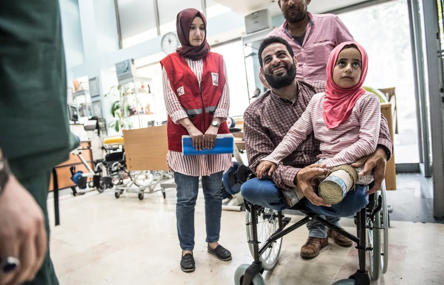 Eight-year-old Syrian girl Maya and her father, born without legs, arrive to an Istanbul clinic on June 29, 2018, to get prosthetic legs. (AFP)
