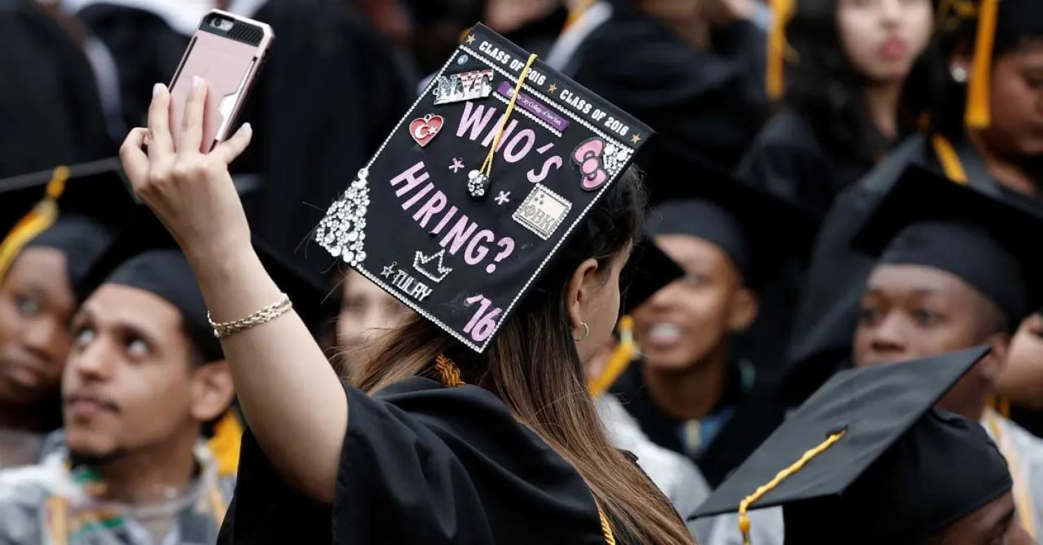A City College of New York graduate takes a selfie during the commencement ceremony. Mike Segar | Reuters