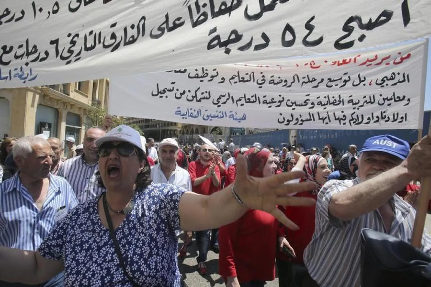 Lebanon's public sector employees march through Beirut to demand the parliament to approve a new salary scale law which if passed means a significant wages increase, April 29, 2014. REUTERS/Sharif Karim