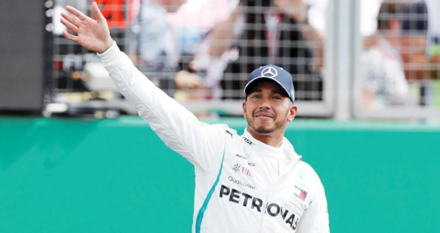 هاميلتون تفوق على فيتل بفارق بسيط (رويترز)