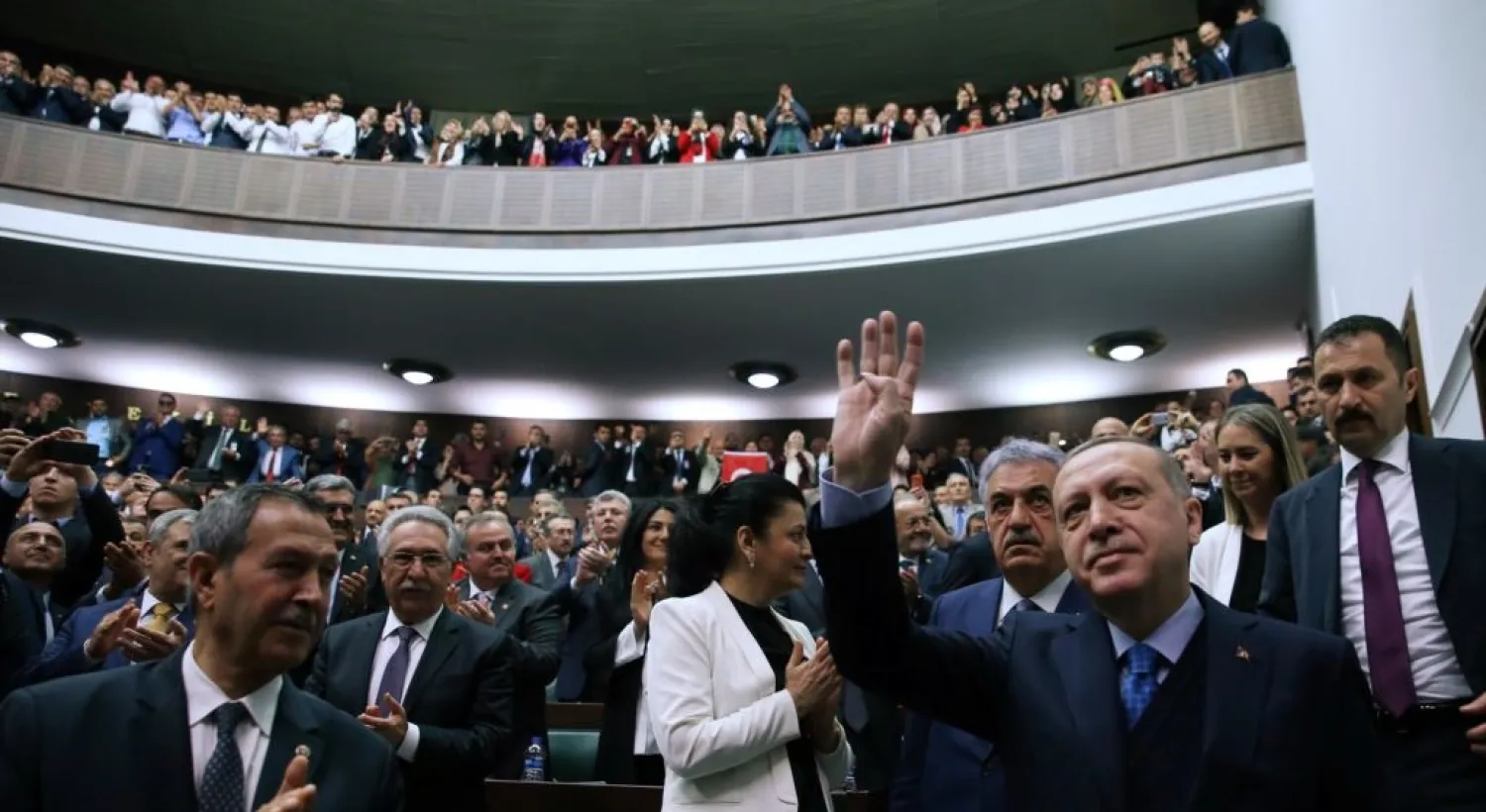 Turkish President Erdogan greets members of parliament from his ruling AK Party during a meeting in Ankara, April 24, 2018. (Reuters)