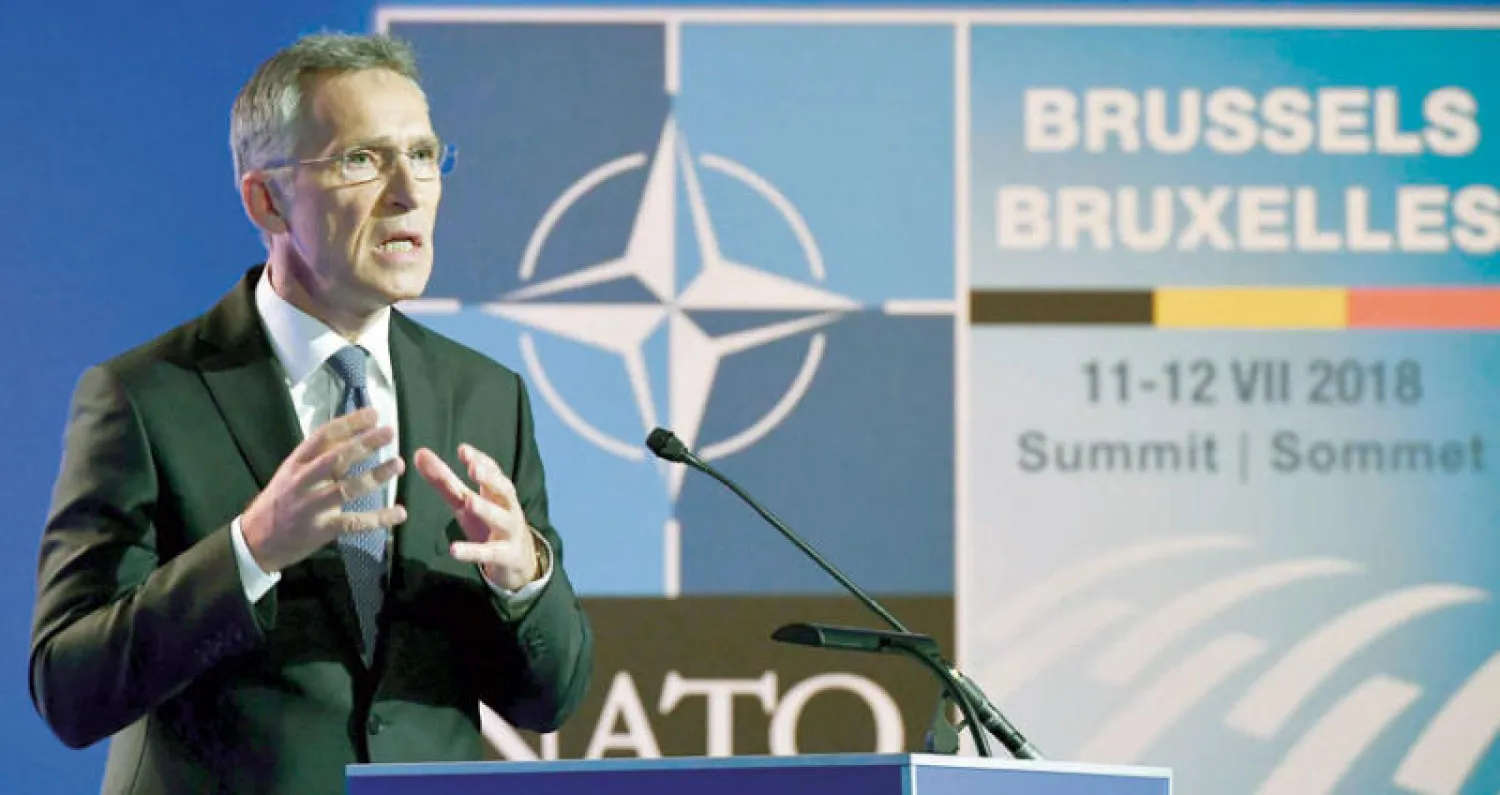 الأمين العام لحلف {الناتو} خلال مؤتمر صحافي في بروكسل أمس (أ.ف.ب)