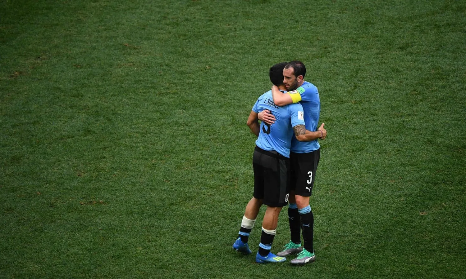 Luis Suárez, left, and Diego Godín react embrace after the defeat to France in the World Cup quarter-final. Photograph: Johannes Eisele/AFP/Getty Images