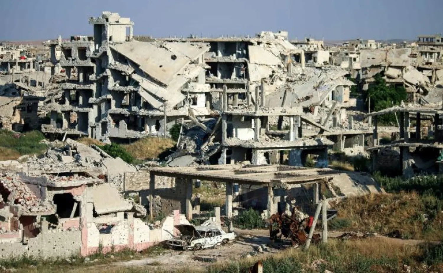 مبان مدمرة في محافظة درعا جنوب سوريا (أ.ف.ب)
