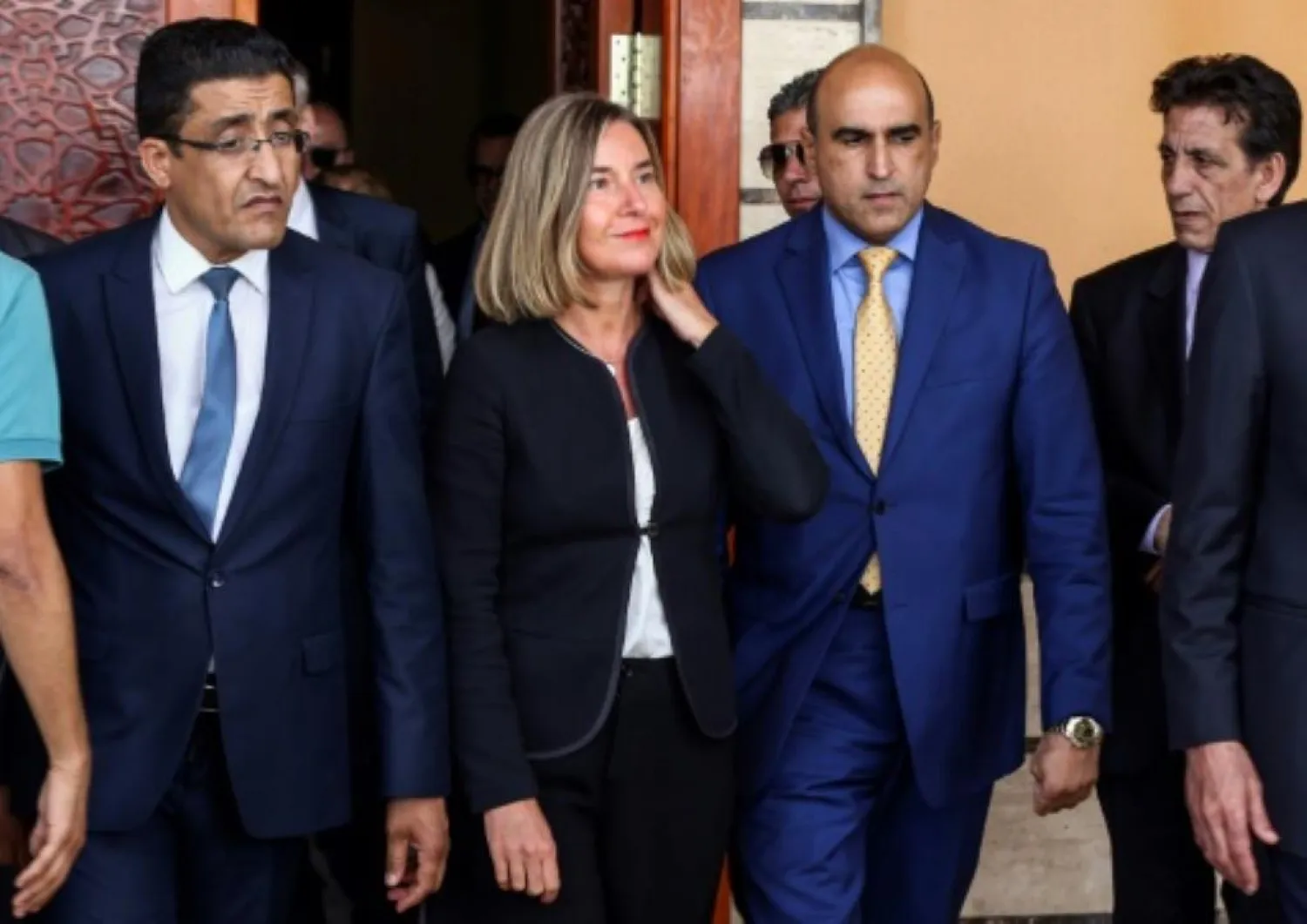 European Union foreign policy chief Federica Mogherini (C) at Mitiga International Airport, near Tripoli, on July 14, 2018. (AFP)