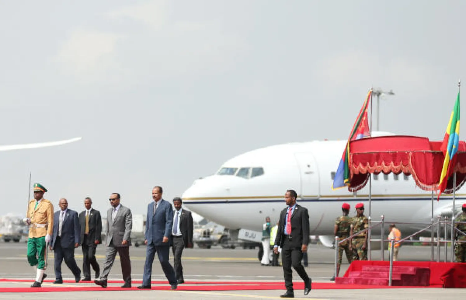 Eritrea's President Isaias Afwerki is welcomed by Ethiopian Prime Minister Abiy Ahmed upon arriving for a three-day visit, at the Bole international airport in Addis Ababa, Ethiopia July 14, 2018. REUTERS/Tiksa Negeri