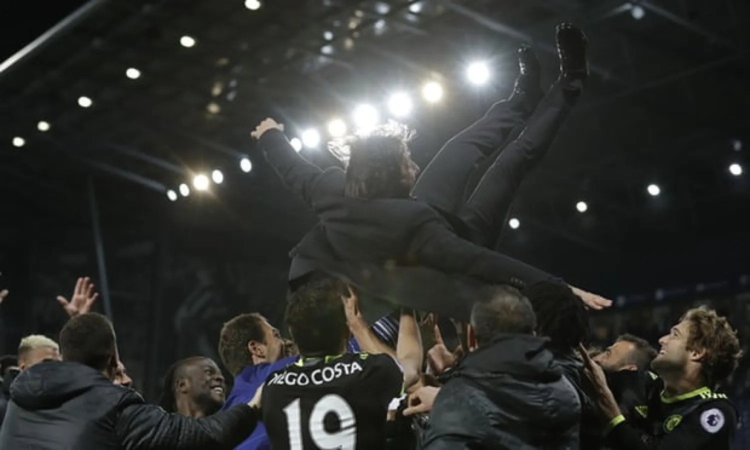  Antonio Conte is lifted into the air by his Chelsea players after sealing the Premier League title in 2016-17. Photograph: Tom Jenkins for the Guardian
