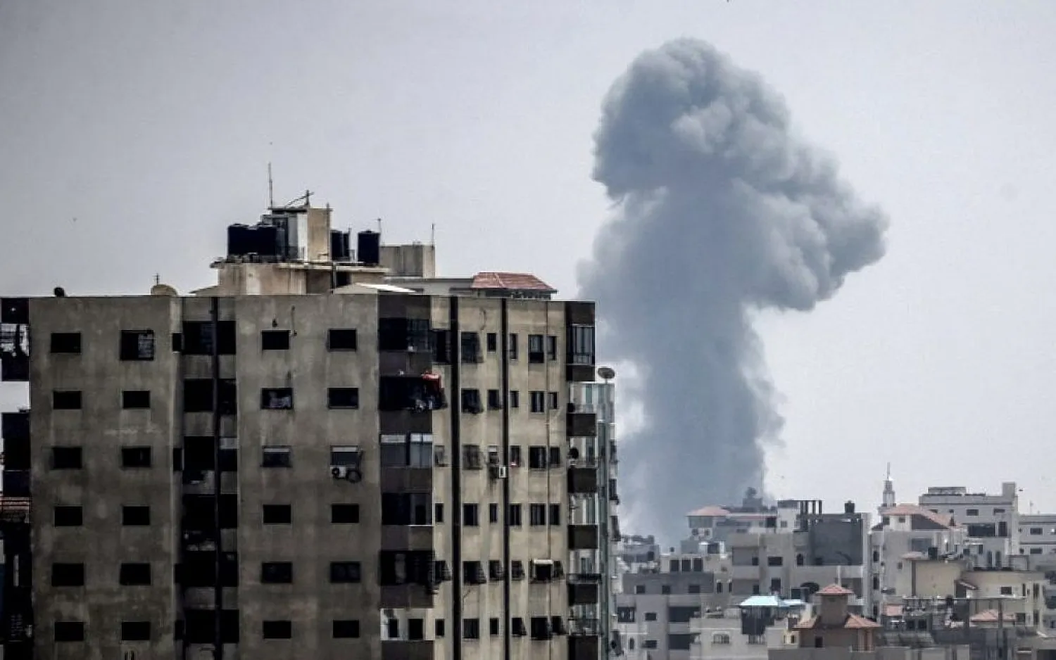 A smoke plume rising following an Israeli air strike in Gaza City. (AFP)