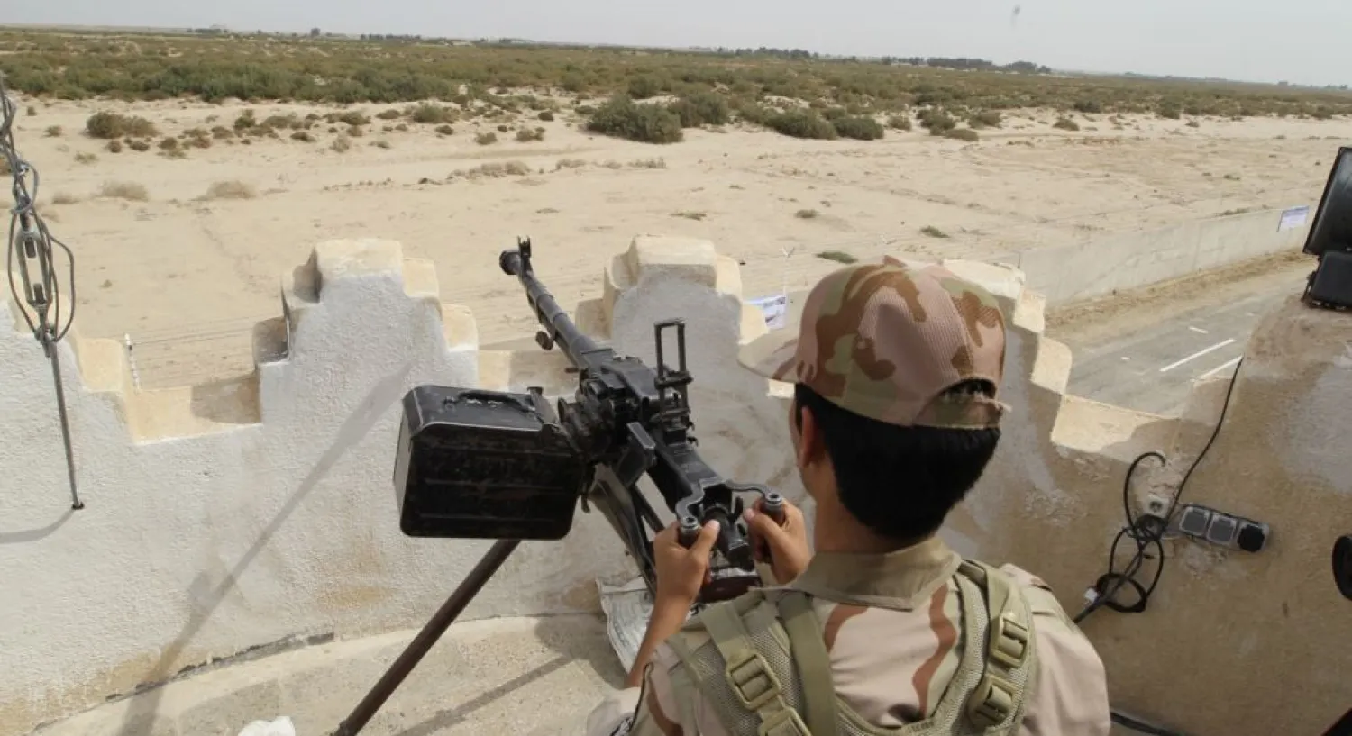 An Iranian border guard keeps watch at a border post. (AFP)