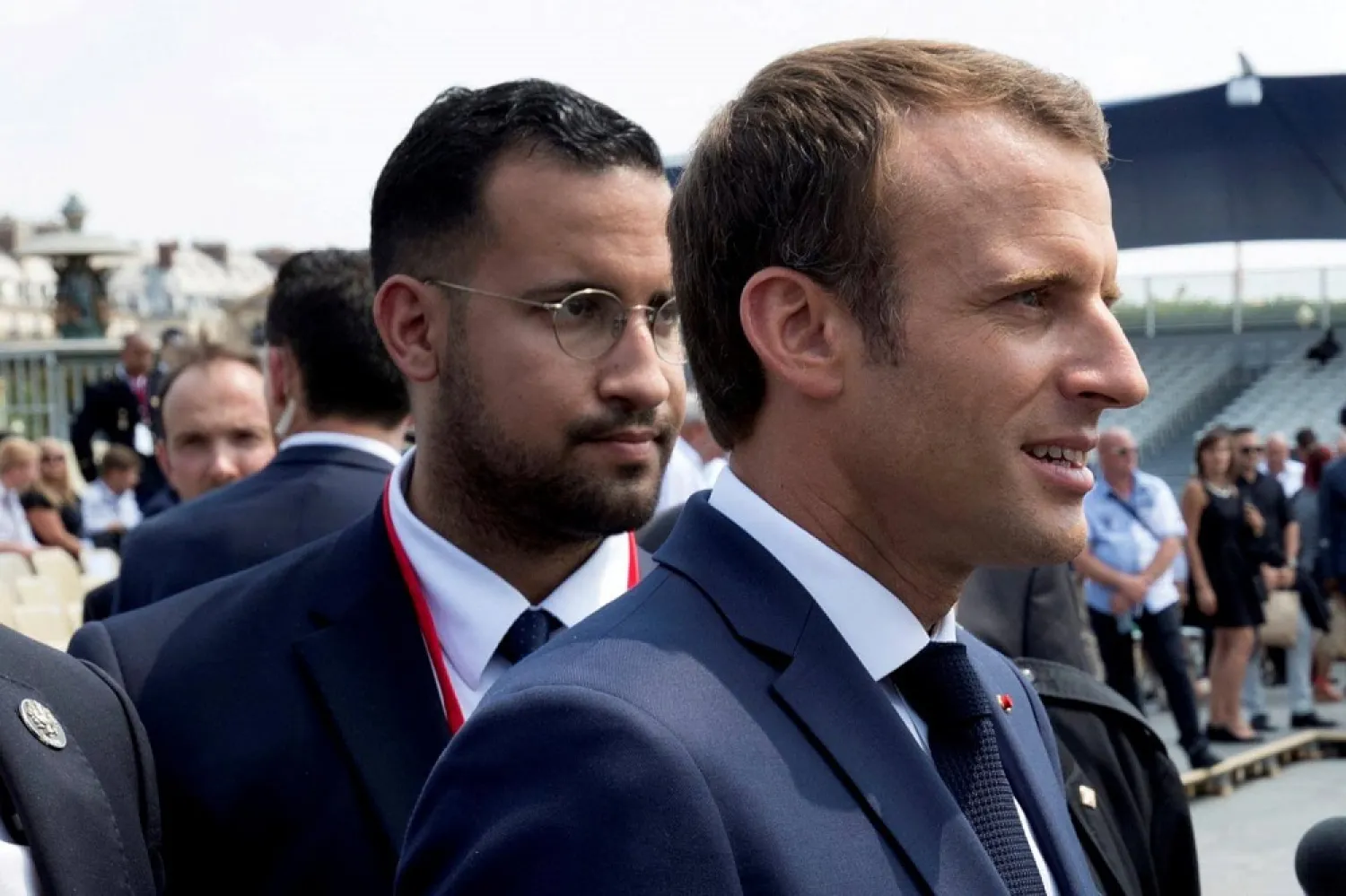 French President Macron walks ahead of his aide Alexandre Benalla at the end of the Bastille Day military parade in Paris, France, July 14, 2018. (Reuters)