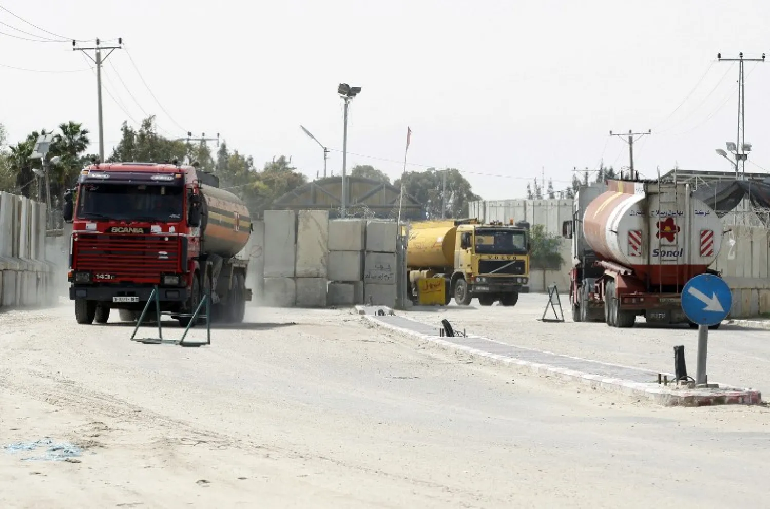 Iraqi security forces are seen during a protest at the main entrance to the giant Zubair oilfield near Basra (Reuters)
