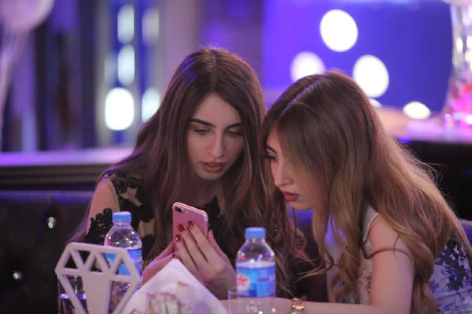 Women use their mobile phones at Luxury Time, the city's first women-only restaurant, in Erbil, Iraq July 17, 2018. Picture taken July 17, 2018. REUTERS/Azad Lashkari