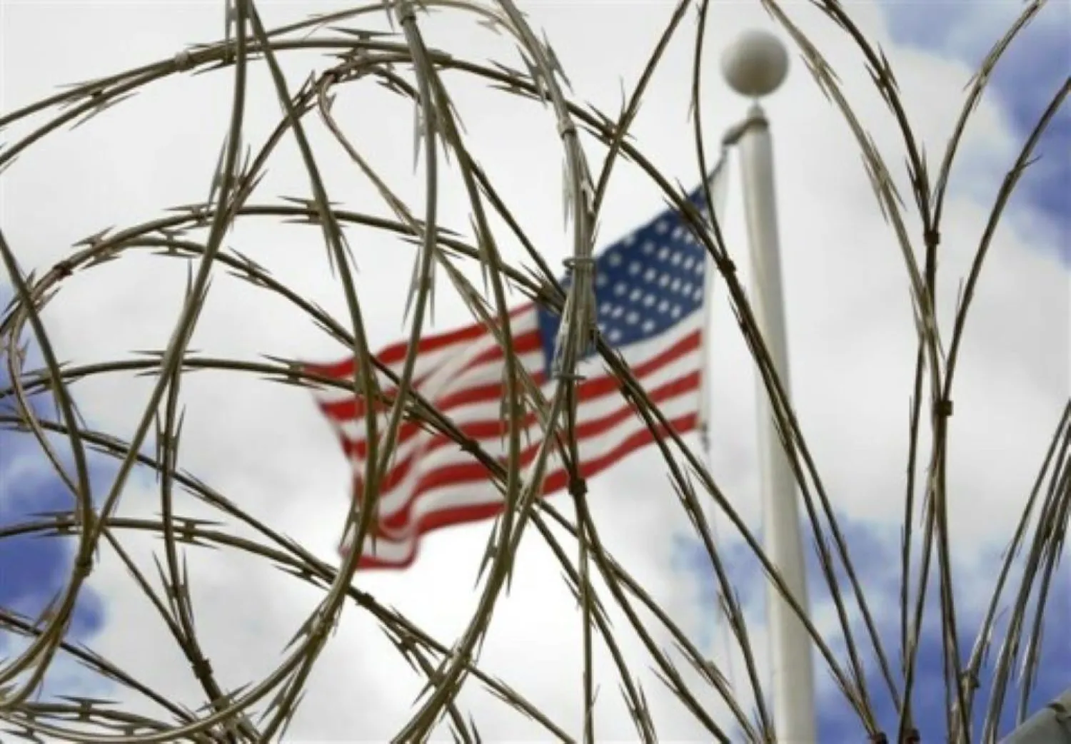 The US flag flies above the US Naval Base at Guantanamo Bay, Cuba. By Paul J. Richards (AFP)