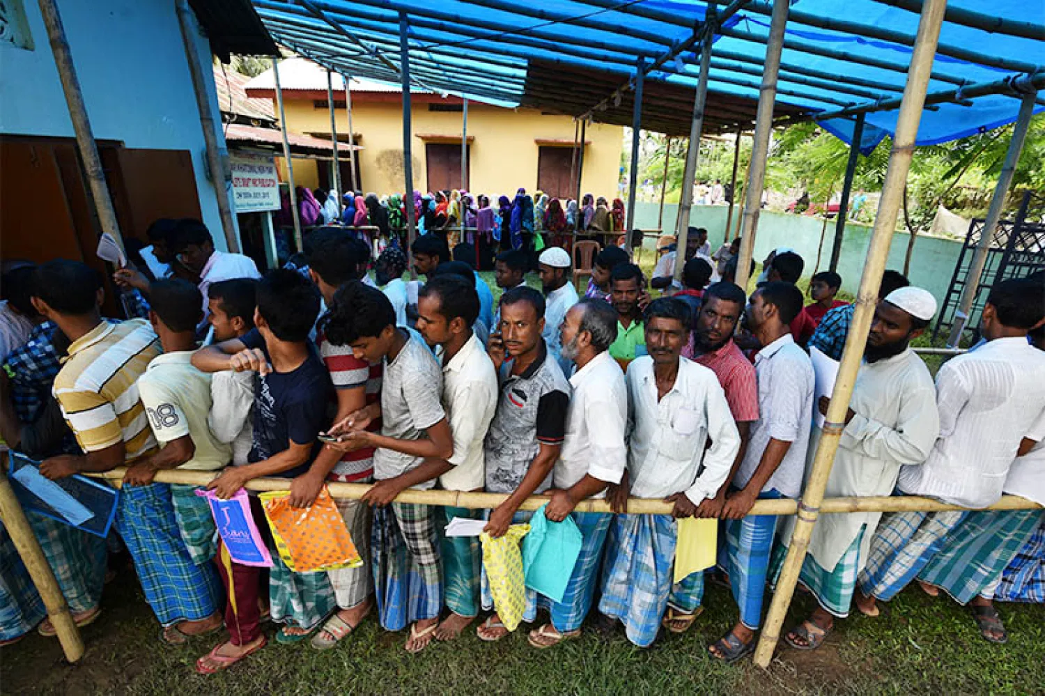 People wait in queue to check their names on the draft list at the National Register of Citizens (NRC) centre at a village in Nagaon district, Assam state, India, July 30, 2018. Photo: Reuters