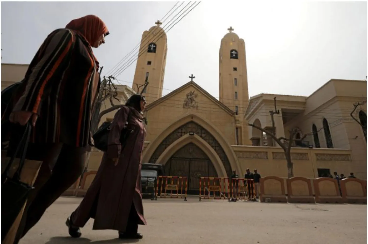 Women pass by the Coptic church that was bombed on Sunday in Tanta, Egypt, April 10, 2017. REUTERS/Mohamed Abd El Ghany
