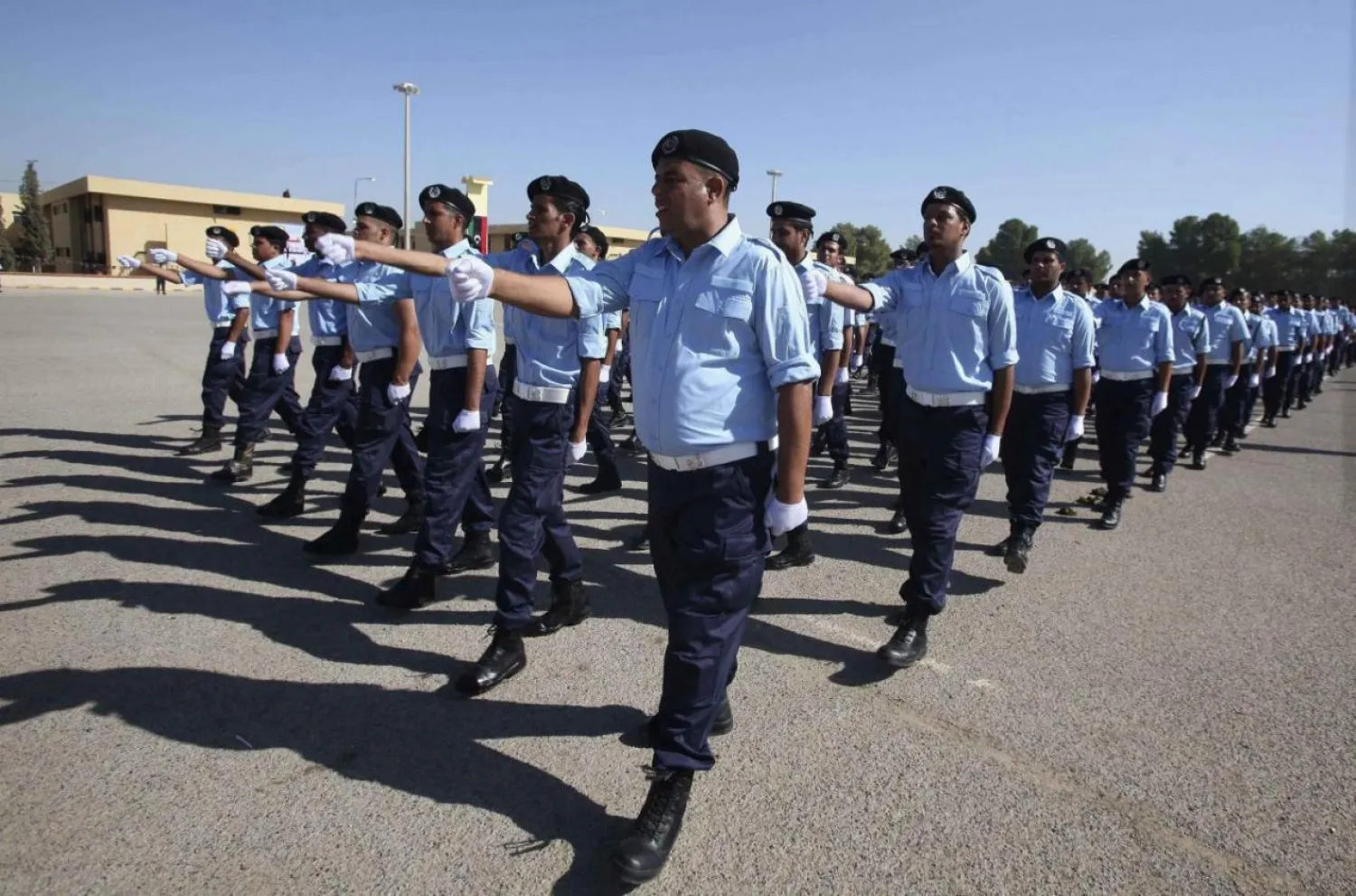 Newly-graduated Libyan police officers march during their graduation ceremony at the compounds of a Police Academy in Tripoli, Libya, October 31, 2013.