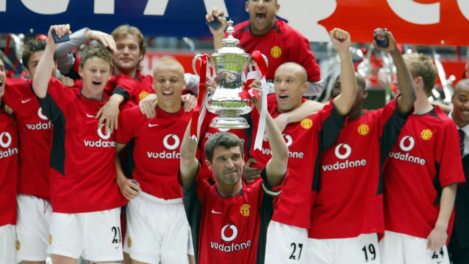 Manchester United's captain Roy Keane, center, lifts the FA Cup after his team's 3-0 win over Millwall in the 2004 final. (AFP)