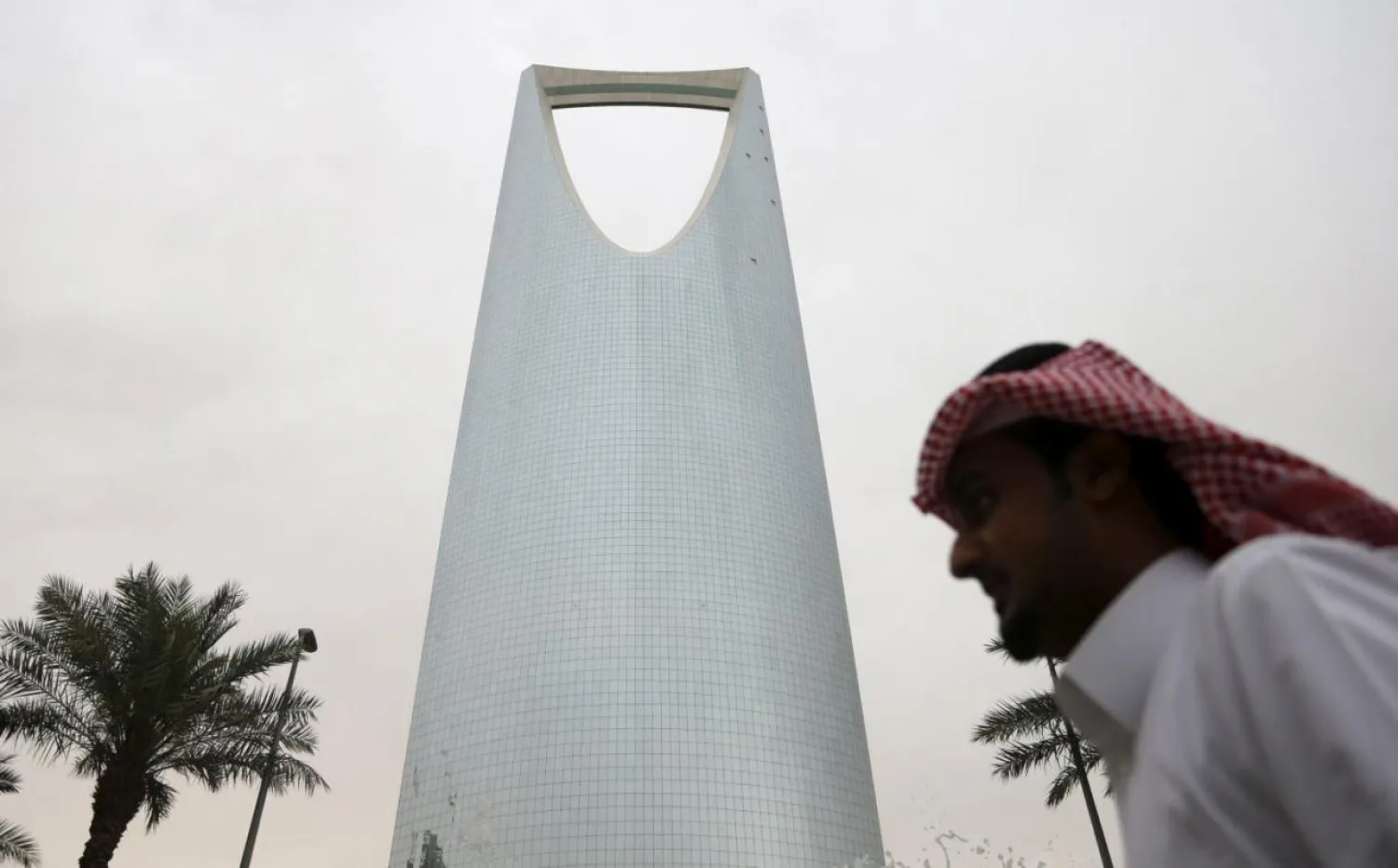 A man walks past the Kingdom Centre Tower in Riyadh, Saudi Arabia April 12, 2016. REUTERS/Faisal Al Nasser