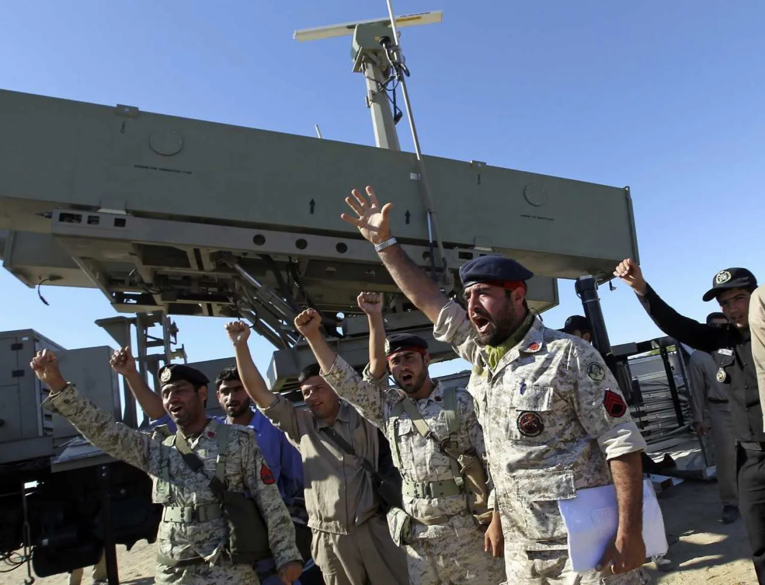 Iranian navy personnel celebrate after successfully launching a Ghader missile, January 1, 2013. (AP/Jamejam Online, Azin Haghighi)