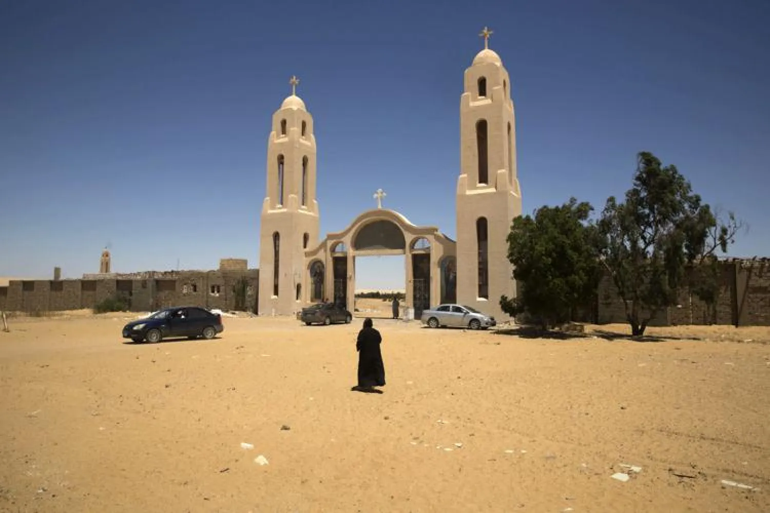 In this May 27, 2017 file photo, a priest walks in front of St. Samuel the Confessor Monastery in Maghagha, Egypt. (AP)