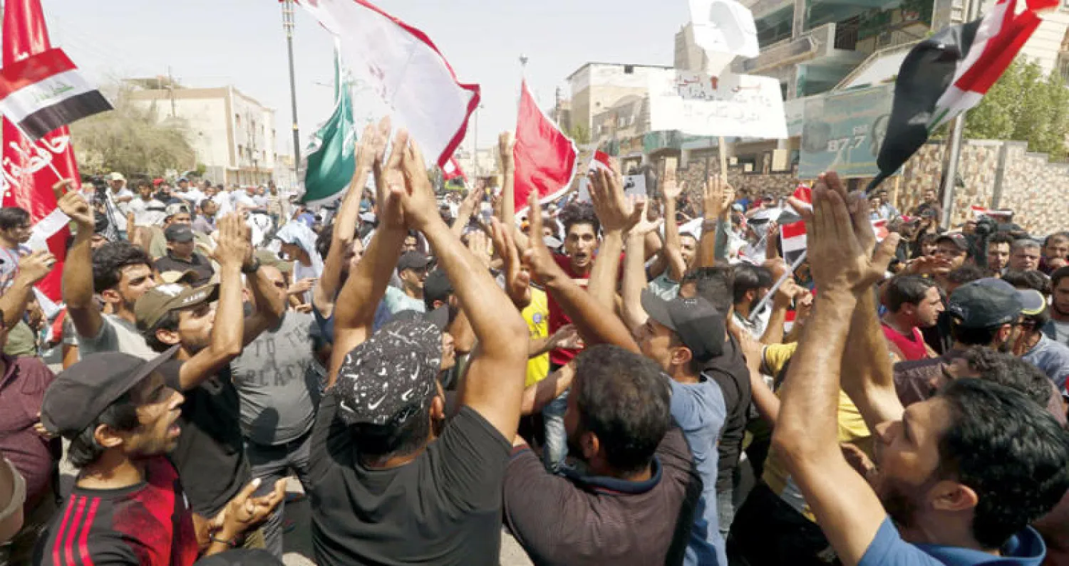 خلال الاحتجاجات في البصرة (أ.ف.ب)