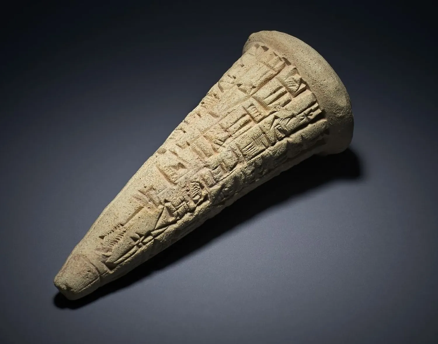 One of three fired clay cones carrying Sumerian inscriptions that gave a clue to their origins. (AFP)