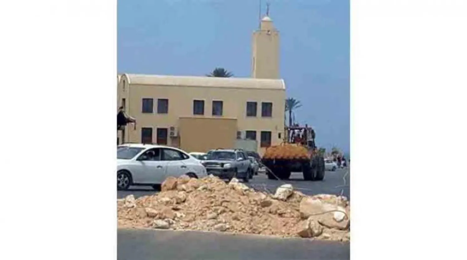 Images circulated by Libyan media of armed groups setting up barriers in Tripoli on Tuesday.