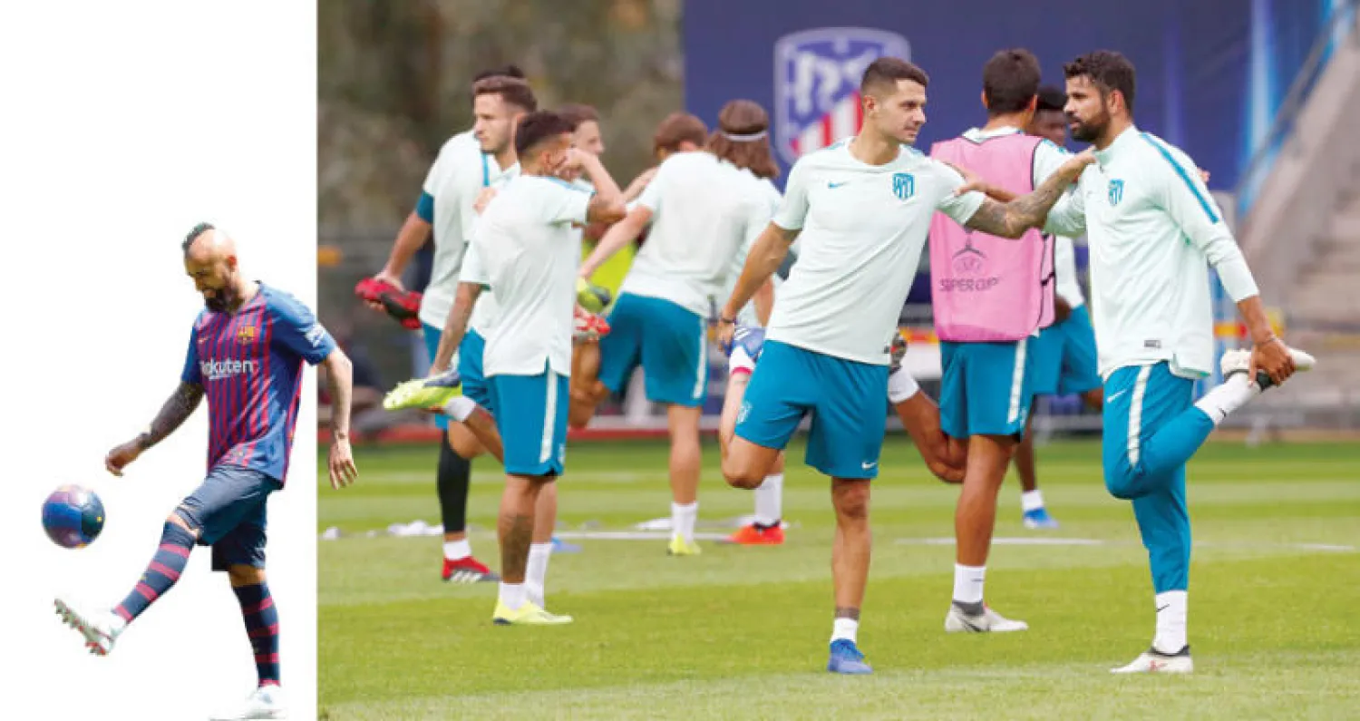 أتلتيكو مدريد مرشح بقوة للمنافسة على لقب الدوري الإسباني (رويترز)  -  برشلونة يأمل بأن يقوم فيدال بدور الساحر إنييستا (أ.ف.ب)