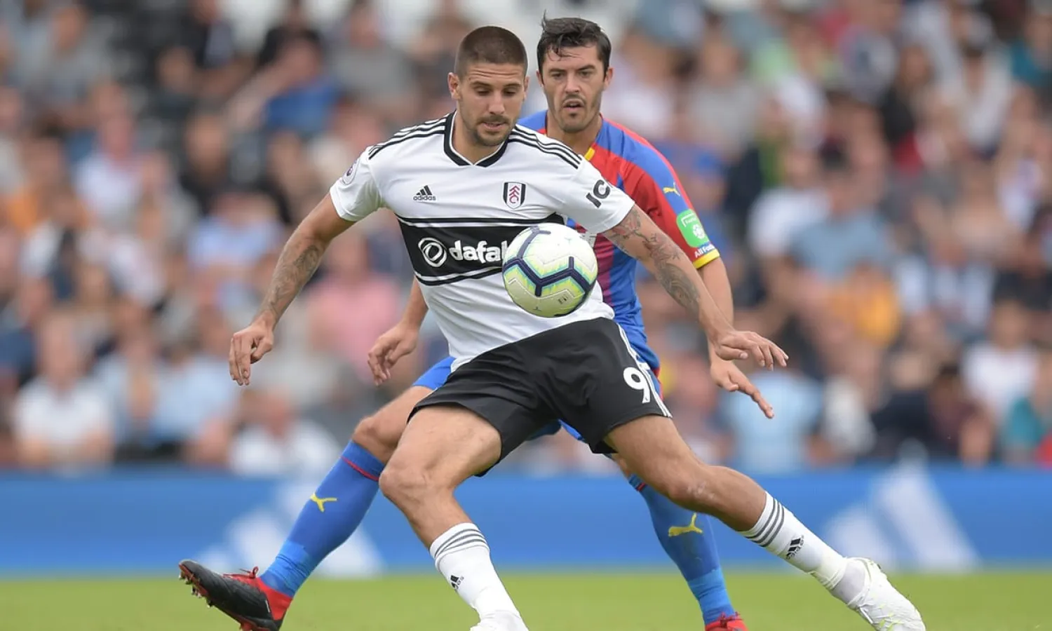  Aleksandar Mitrovic looks to retain possession while under pressure from James Tomkins during Fulham’s 2-0 defeat to Crystal Palace at Craven Cottage. Photograph: Joe Toth/BPI/Rex/Shutterstock