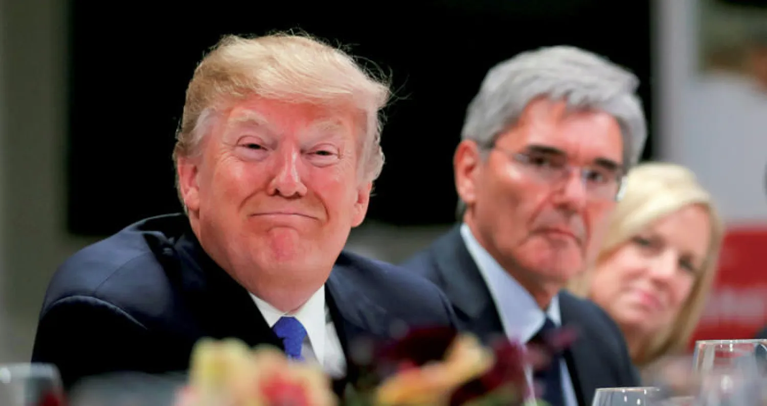 صورة أرشيفية لترمب خلال مؤتمر دافوس الاقتصادي في يناير الماضي (رويترز)