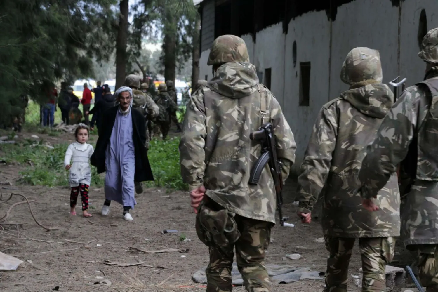 Algerian soldiers and citizens walk in Boufarik, about 30Kms south of the capital Algiers, Algeria, April 11, 2018. Getty Images