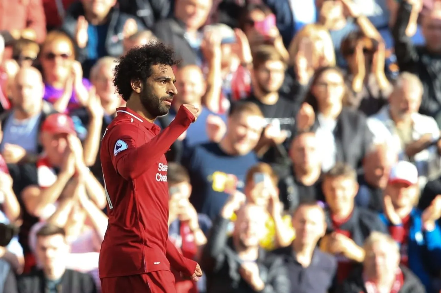 Mohamed Salah celebrates after scoring against Brighton on Saturday. (AFP)
