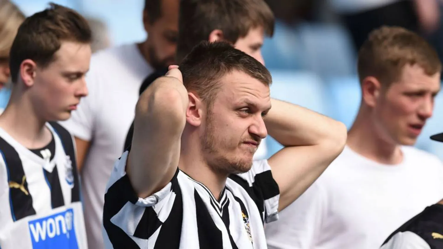 Newcastle fans react after their team was relegated from the Premier League in 2016. (AFP)