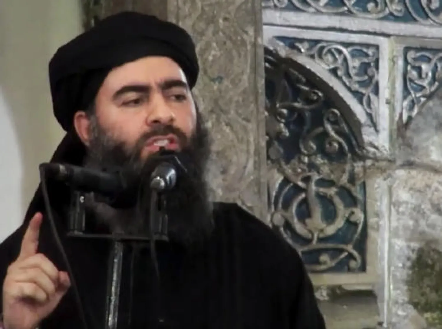 This image made from video posted on a militant website July 5, 2014, purports to show the leader of the Islamic State group, Abu Bakr al-Baghdadi, delivering a sermon at a mosque in Iraq during his first public appearance. (Militant video via AP, File)