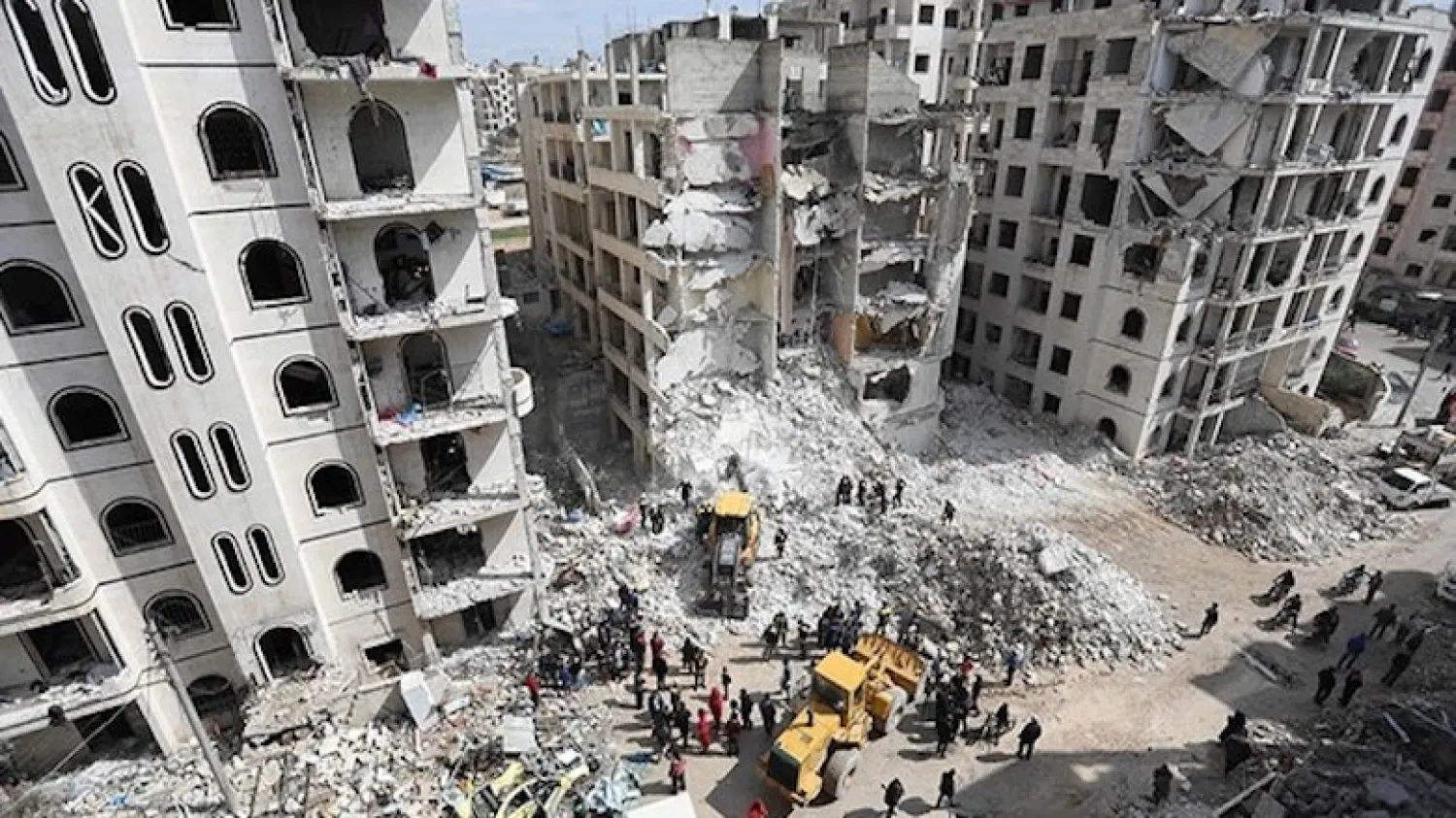 Syrian rescuers clear the rubble in the morning of April 10, 2018, at the site of an explosion in Idlib. AFP photo