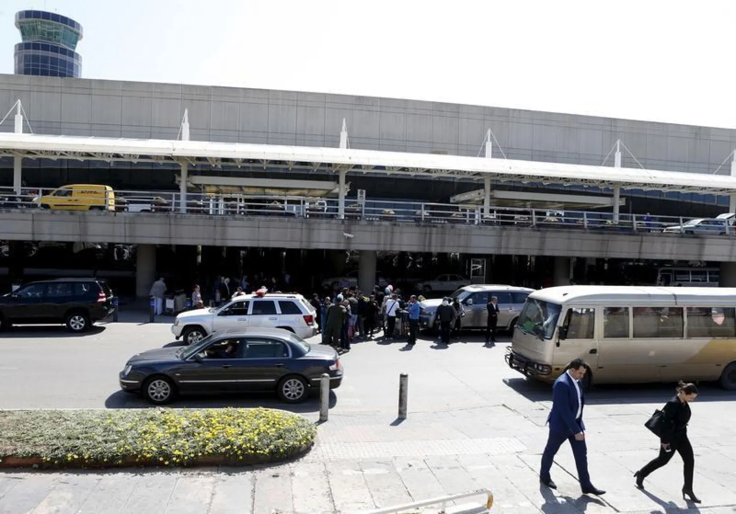 People walk outside Beirut international airport in Beirut, Lebanon March 29, 2016. Picture taken March 29, 2016. REUTERS/Mohamed Azakir