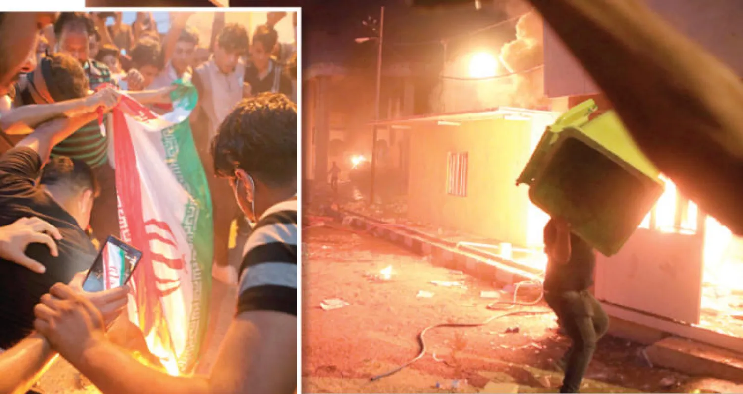 محتجون في مقر القنصلية الإيرانية بالبصرة بعد اقتحامها وإضرام النار فيها مساء أمس (أ.ب)... وآخرون يحرقون العلم الإيراني (أ.ب)