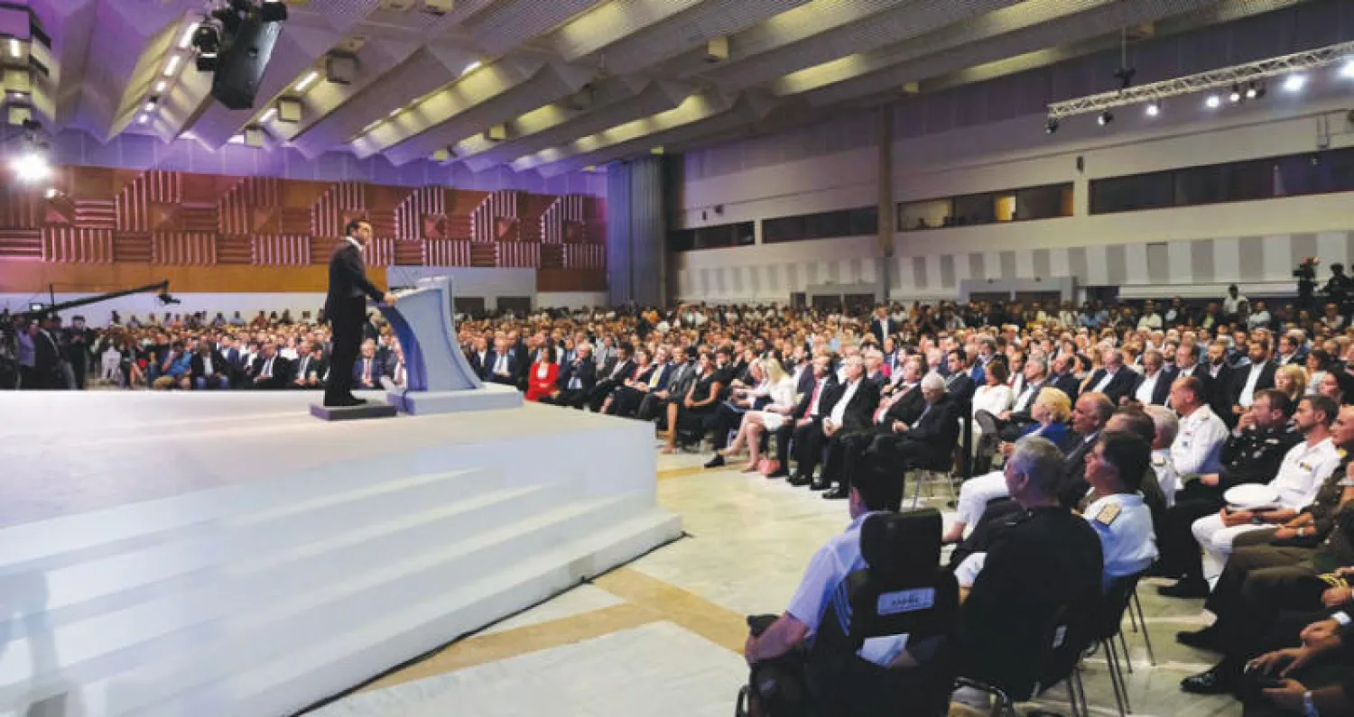 رئيس الوزراء اليوناني في كلمته لعرض برنامجه الاقتصادي للسنوات القادمة خلال زيارته أكبر المعارض التجارية بالبلاد (أ.ف.ب)