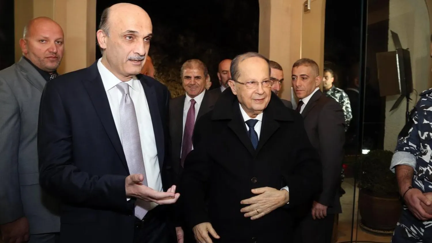 LF chief Samir Geagea welcomes then MP Michel Aoun to his headquarters in Maarab, northeast of Beirut, on January 18, 2016. (AFP)