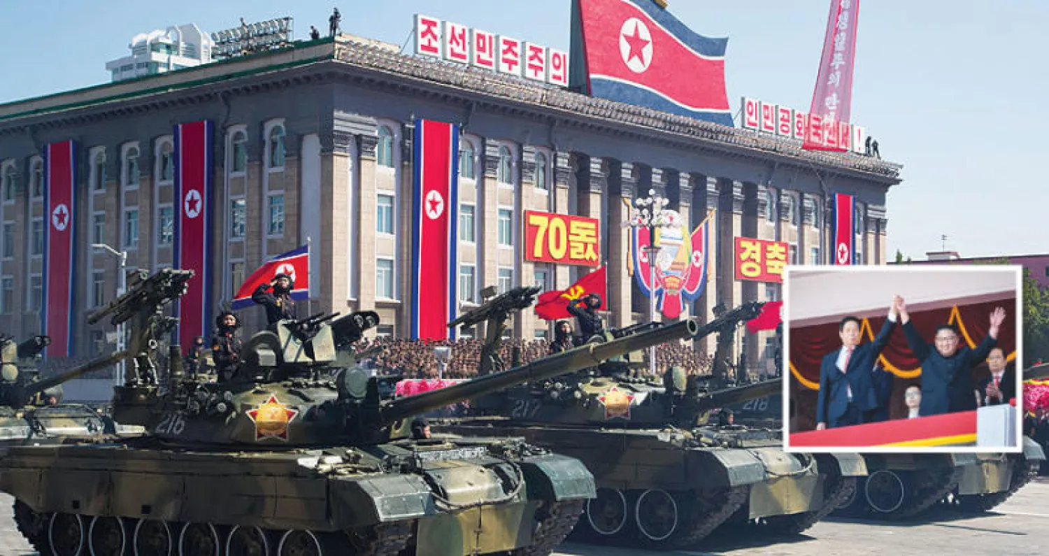 كيم جونغ أون يرحّب برئيس الوفد الصيني الرفيع أمس (أ.ف.ب) - جانب من العرض العسكري في بيونغ يانغ أمس (أ.ب)